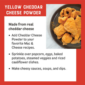 Judee's cheddar powder sprinkled on baked potatoes for a rich finish