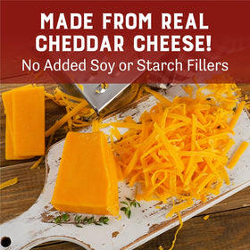 Judee's gluten-free cheddar powder beside nachos, ideal for quick dips.