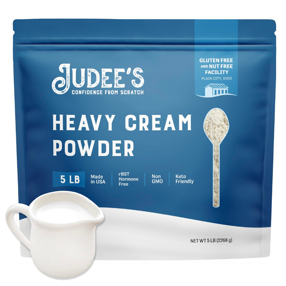 Judee's Heavy Cream Powder packaging showcases shelf-stable, versatile dairy for cooking and whipping.