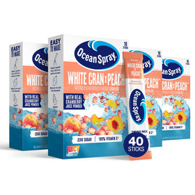 Juicy Mixes Ocean Spray White Cran-Peach packets on the go for quick refreshment.