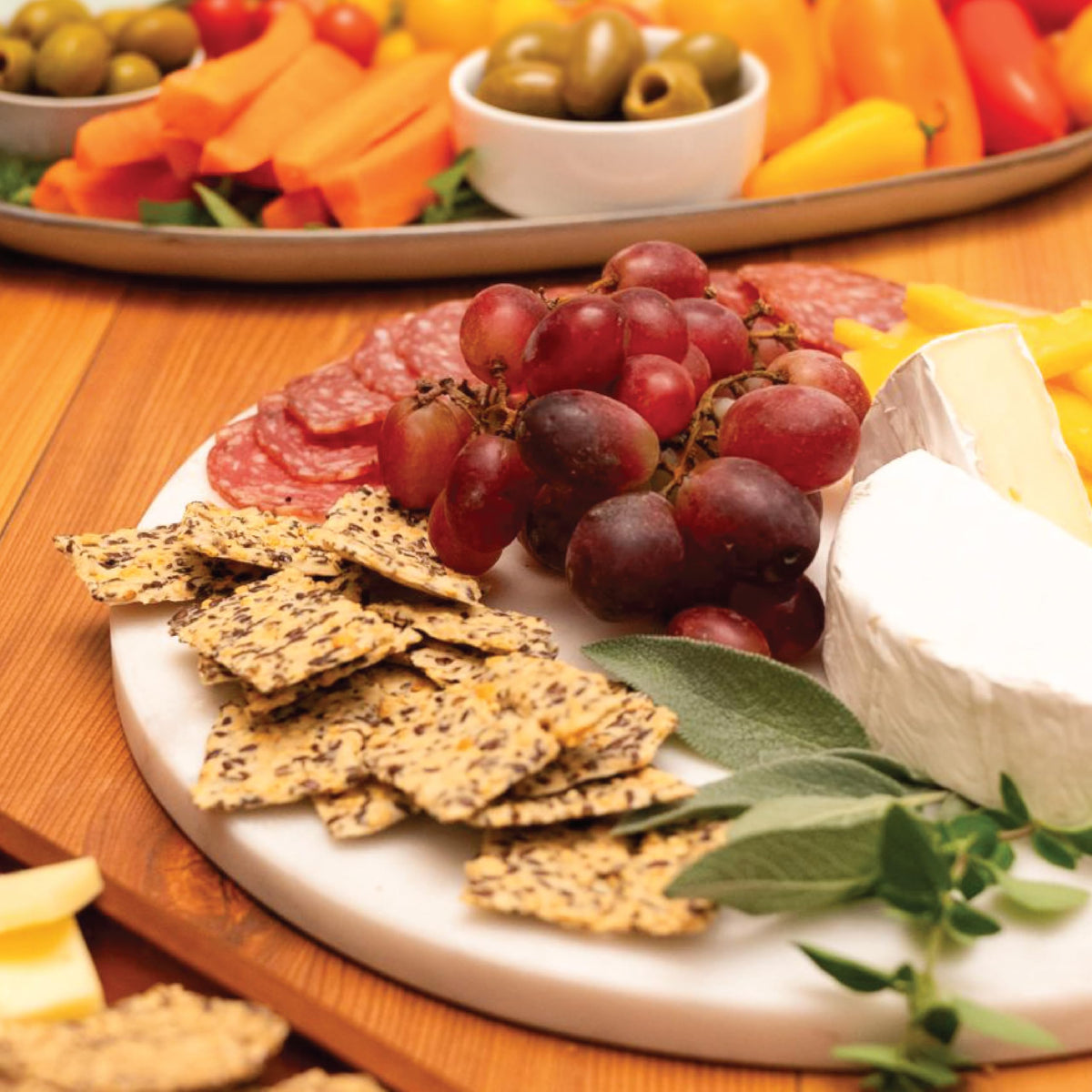 Julian Bakery Paleo Thin Crackers Salt Pepper on a cutting board, ready for crunch-time.