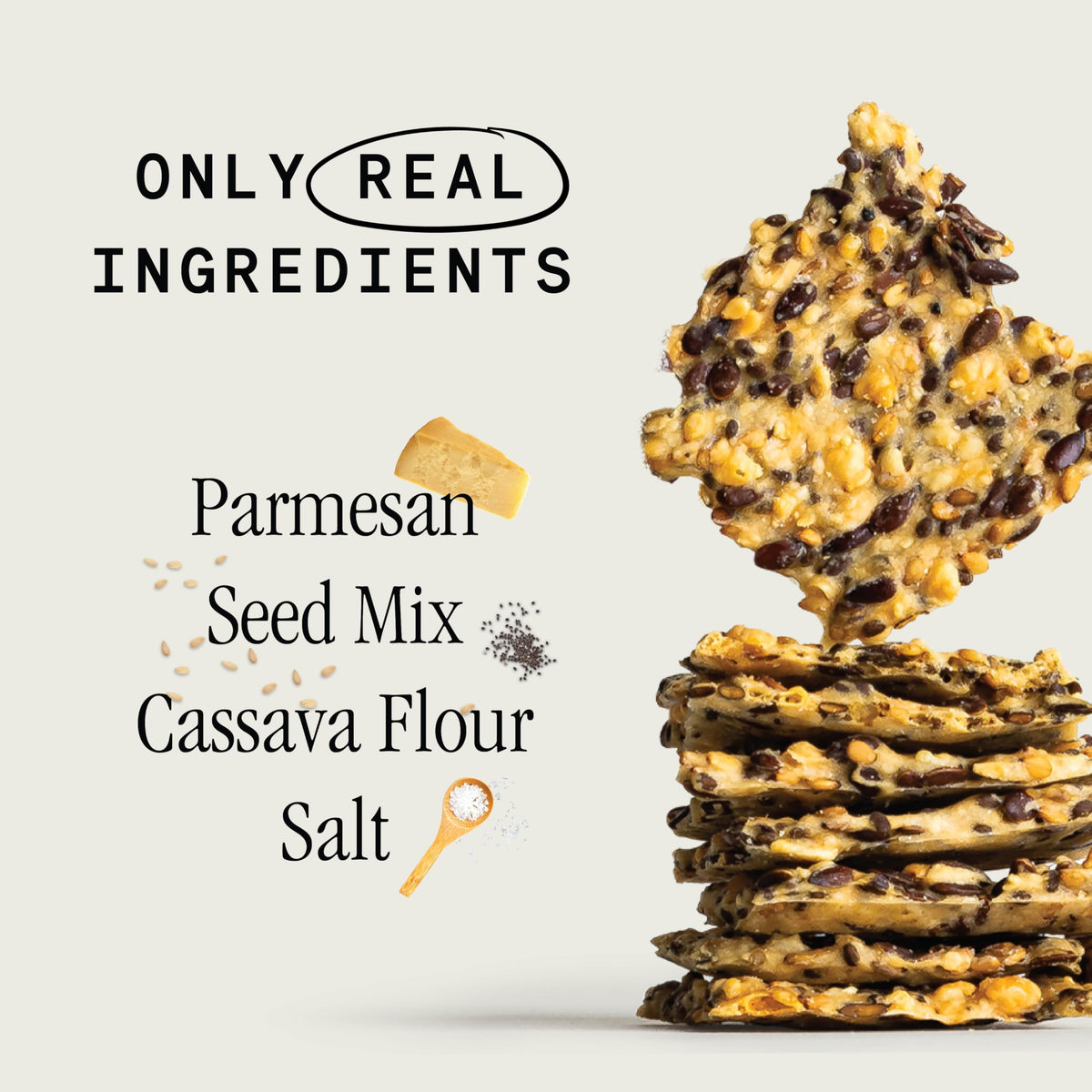 Julian Bakery Primal Thin Crackers Parmesan served on a plate with fresh ingredients.
