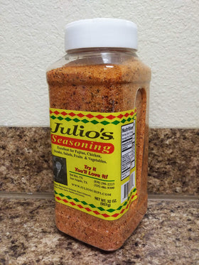 Julio's Seasoning being sprinkled on meat for enhanced flavor.