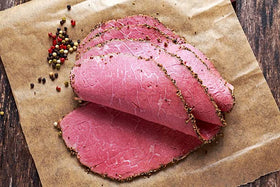 June Moon Too Tall Texan Roadhouse rub on chicken on the grill