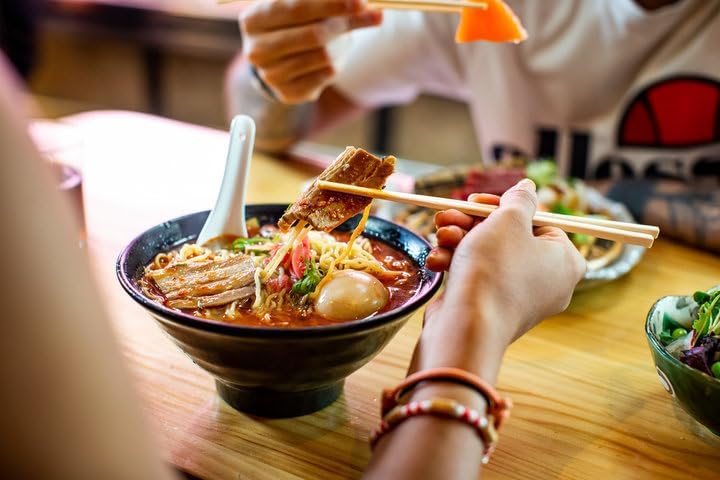 June Moon Ramen Seasoning with fresh garnish suggests customizable flavor.