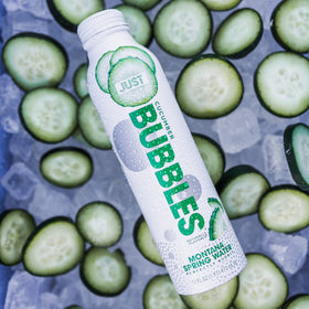 JUST Bubbles Cucumber chilled glass scene suggests thirst-quenching refreshment.