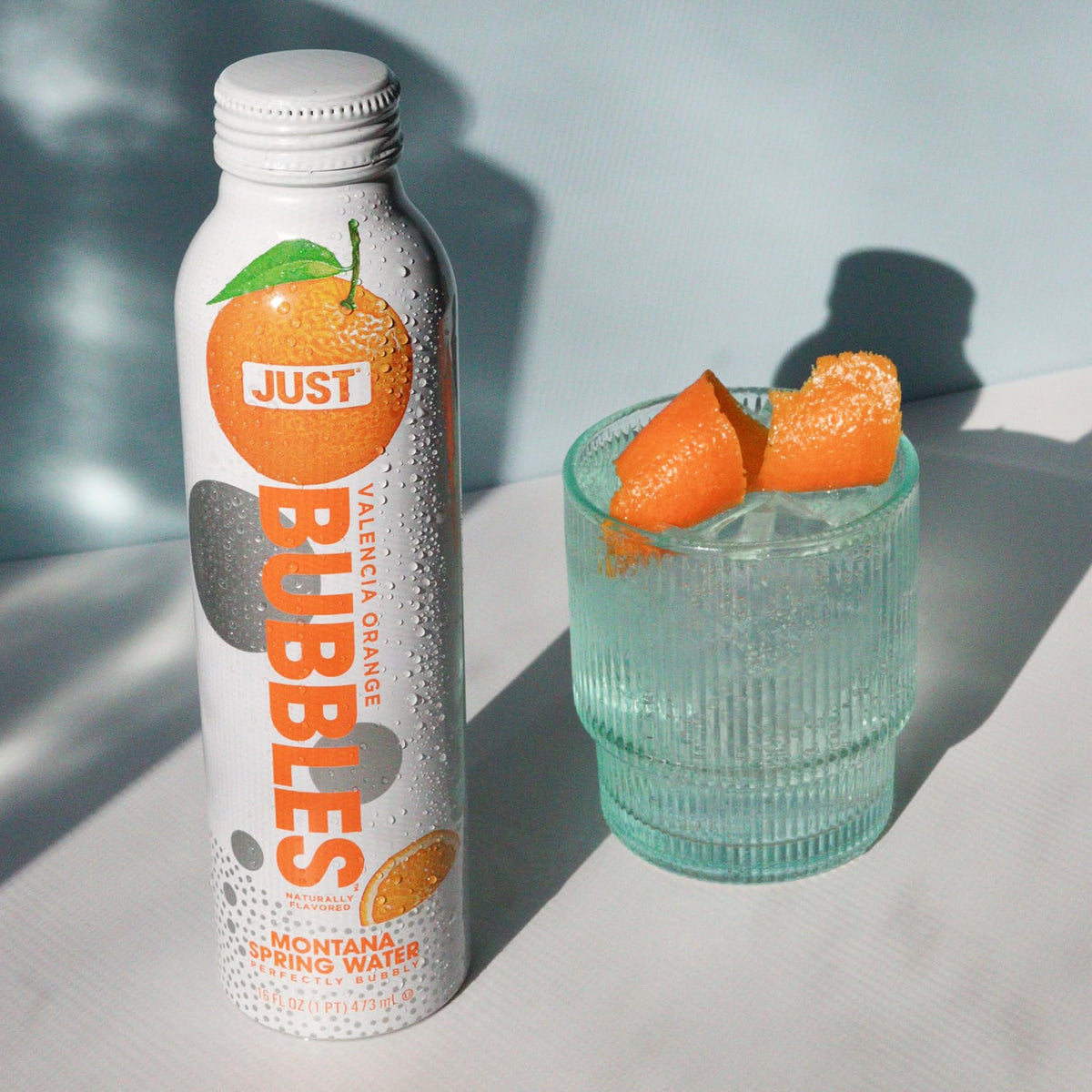 JUST Bubbles Valencia Orange aluminum bottle recyclable messaging