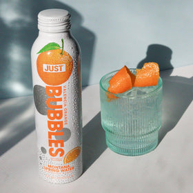 JUST Bubbles Valencia Orange aluminum bottle recyclable messaging
