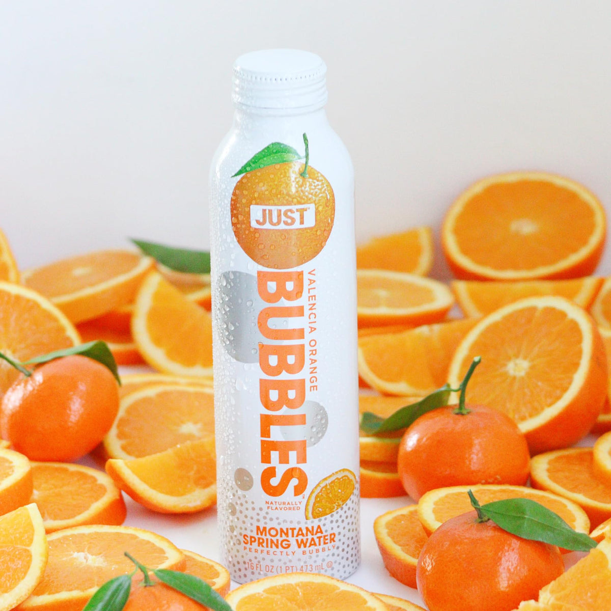 JUST Bubbles Valencia Orange bottle top view highlights eco-friendly packaging