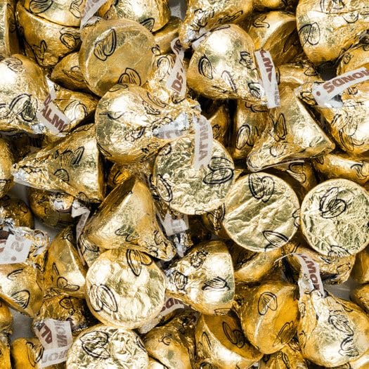 Just Candy gold milk chocolate kisses with almonds in a bag, ideal for celebrations.