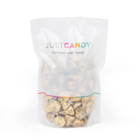 Close-up of Just Candy gold-wrapped almond milk chocolates, premium texture and crunch.