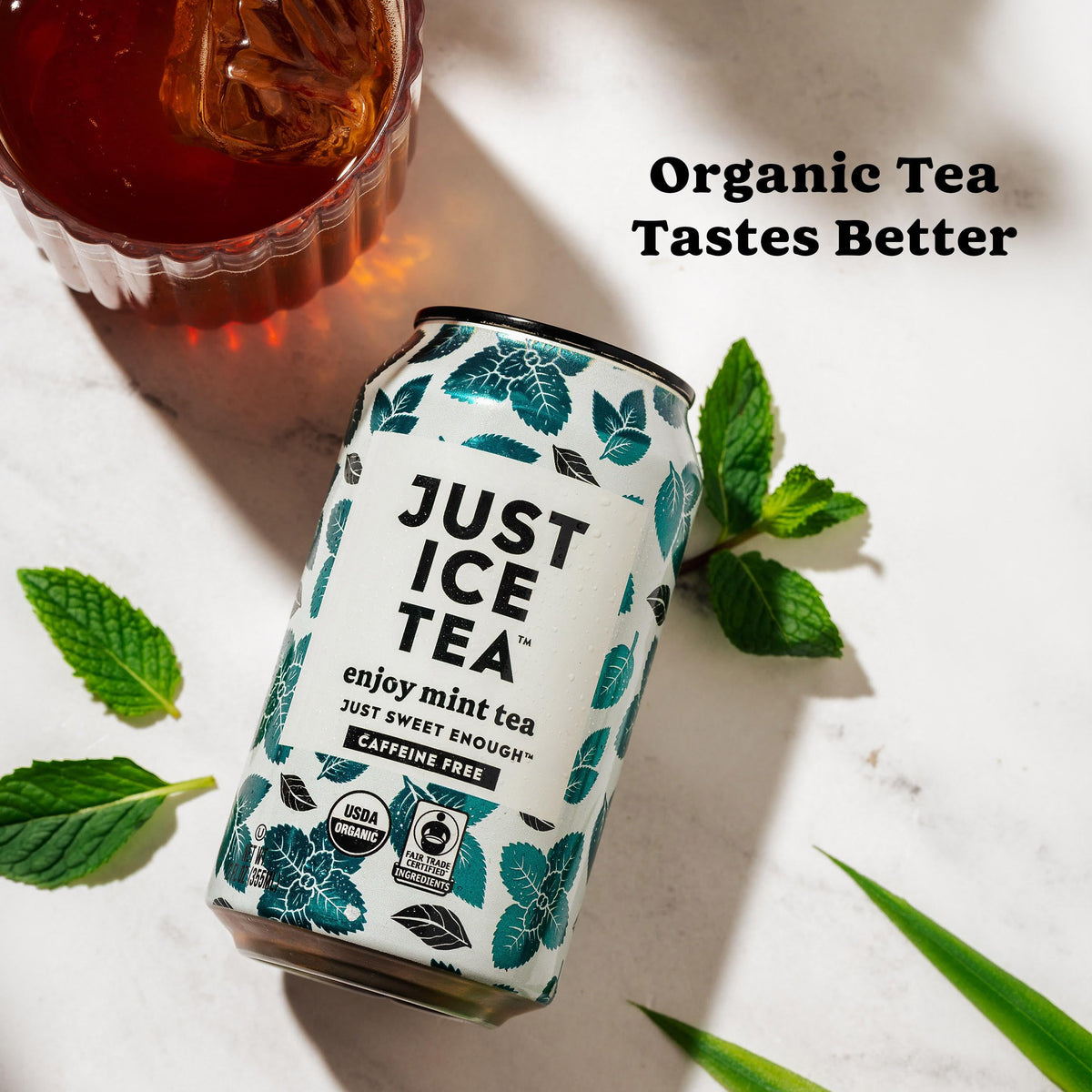 Twelve-pack cans of Just Ice Tea Mint for convenient everyday refreshment