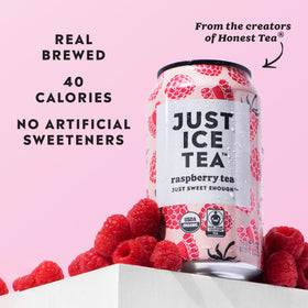Just Ice Tea Raspberry can close-up showing real leaves and organic sourcing.