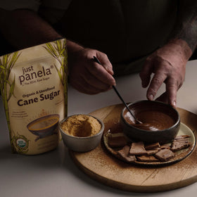 Just Panela organic cane sugar added to coffee for natural sweetness.