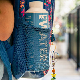 JUST Water bottle in lunchbox, kid-friendly hydration at school.