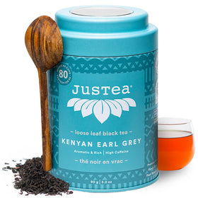 JusTea Kenyan Earl Grey tin with hand-carved spoon for elegant tea rituals.