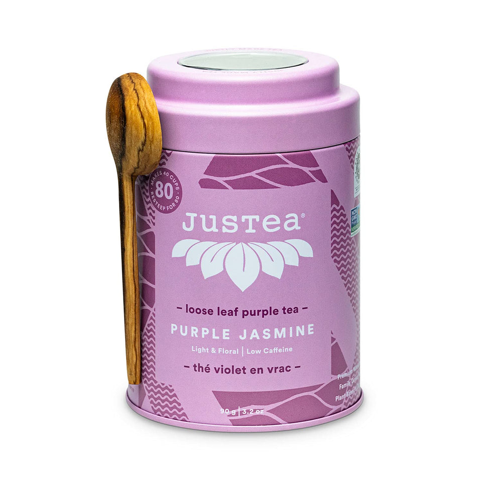 JusTea Purple Jasmine tin with hand-carved spoon ready for elegant tea rituals
