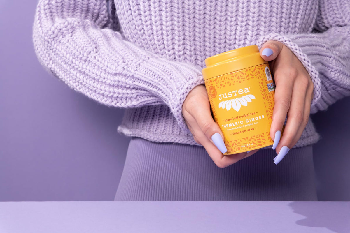 JusTea tin label highlights fair trade and organic sourcing