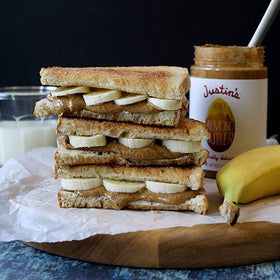 Justin's Honey Almond Butter spoon showcases rich creaminess and versatility.