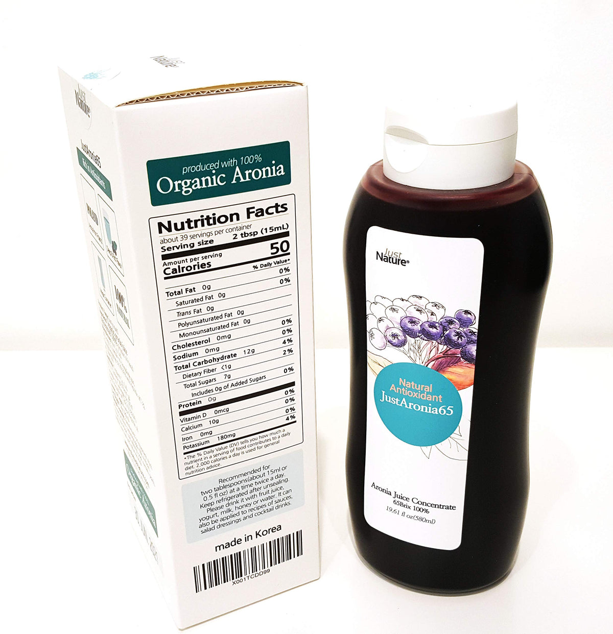 JustNature Polish Aronia juice concentrate being poured into a glass.