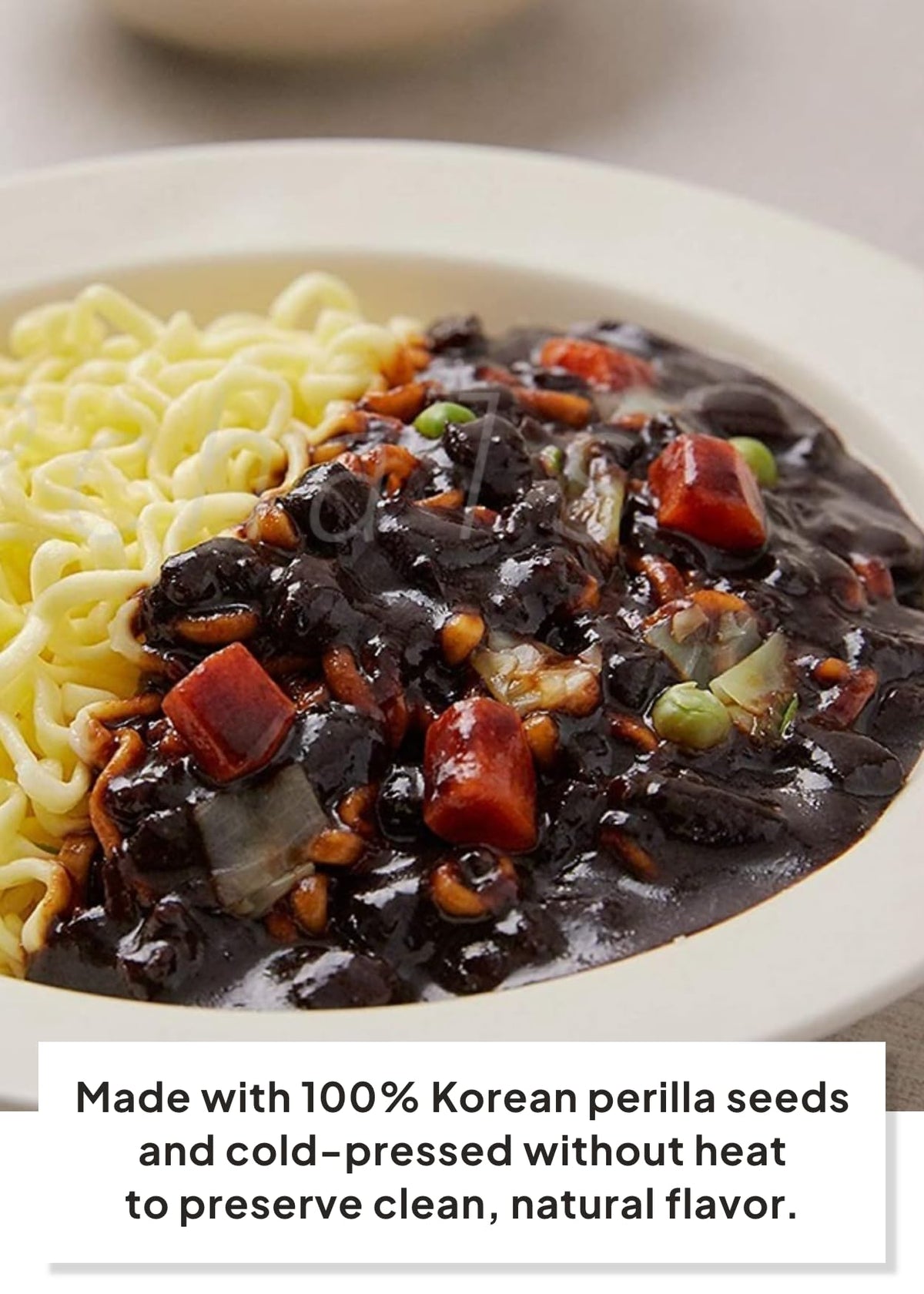 Cooked Paldo Jjajangmen noodles in a glossy sauce bowl.
