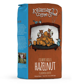 Kalamazoo Coffee Hazlenut Whole Bean Filbert Hills 12oz pack delivering rich aroma for home brewing.