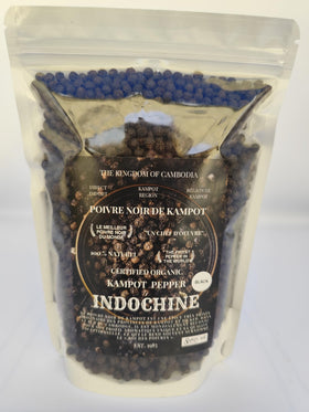 Kampot Pepper black peppercorns in a jar, ready for premium seasoning.