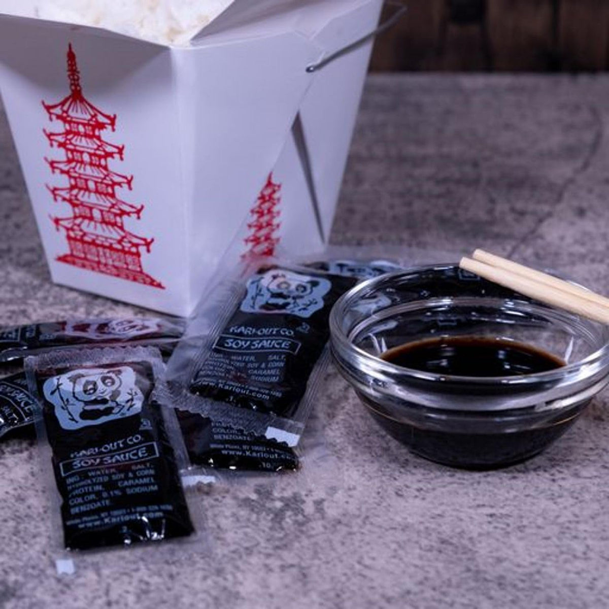 Close-up of Kari-Out 8g soy sauce packet showing portable, mess-free use.