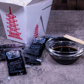 Close-up of Kari-Out 8g soy sauce packet showing portable, mess-free use.