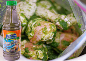 KARIBBEAN FLAVOURS Trinidad Fresh Green Seasoning bottle tilt captures bright, fragrant greens