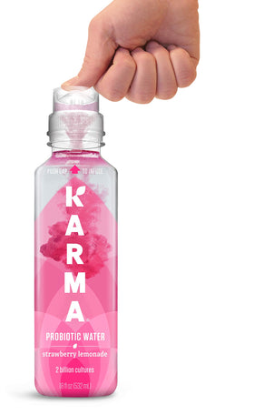 Karma Probiotic Water push-cap bottle showing freshly activated nutrients for peak probiotic potency.