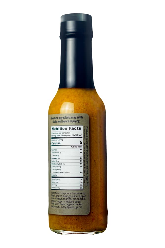 Karma Sauce Ghost Island label visible, premium Caribbean-inspired heat.