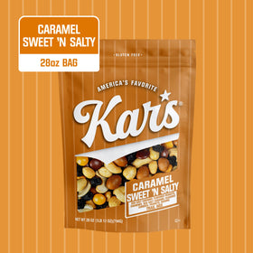 Close-up of roasted peanuts, cashews, and caramel pieces in Kar's Nuts Trail Mix.