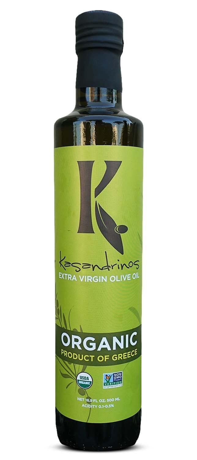 Kasandrinos Organic Olive Oil bottle on a wooden surface for finishing dishes
