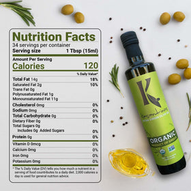 Kasandrinos Organic Olive Oil bottle on a cutting board for dressings