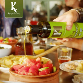 Kasandrinos Organic Olive Oil kitchen scene with olive trees in the background