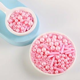 Decorating ice cream with Kasvan pink pearls adds festive flair.