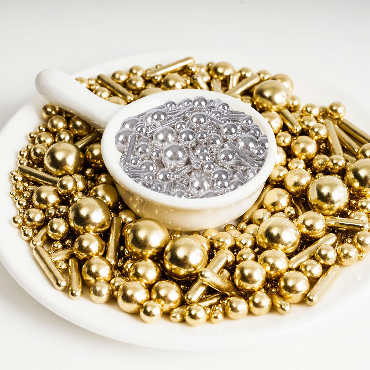 Kasvan gold and silver pearls sparkling on a cake for celebrations.