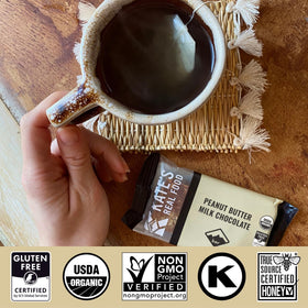 Outdoor hiking scene featuring Kate's Real Food granola bar for adventure-ready snacking.