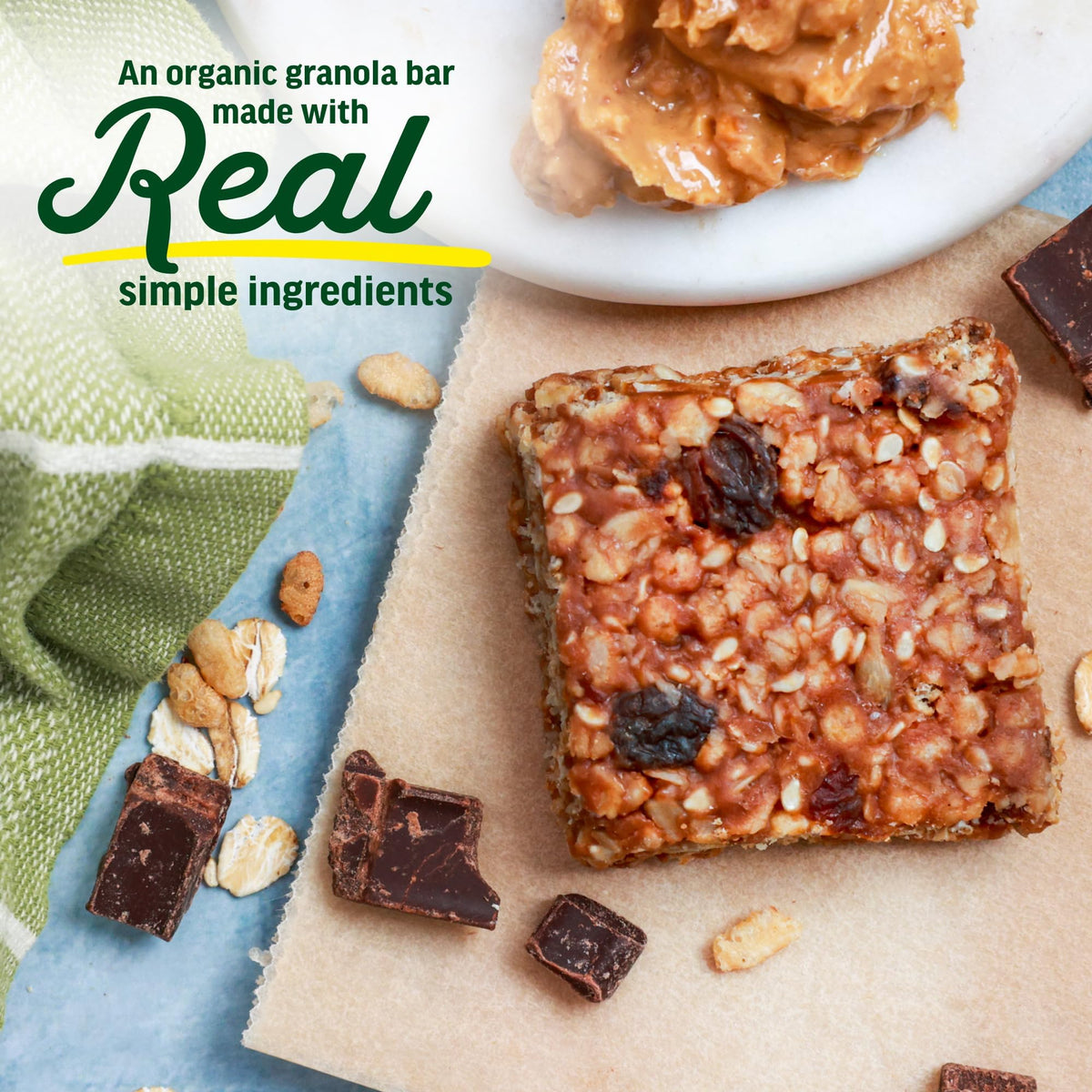 Close-up of Kate’s Real Food mini granola bar texture with oats and dark chocolate.