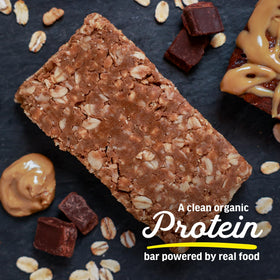 Kate's Real Food Peanut Butter Brownie bar closeup highlighting dark chocolate and creamy peanut butter.