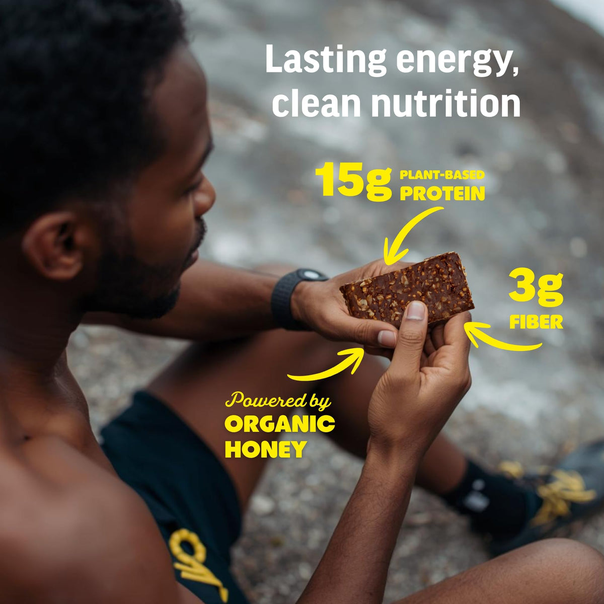 Kate's Real Food Peanut Butter Brownie bar in hand emphasizes portable protein for busy days.