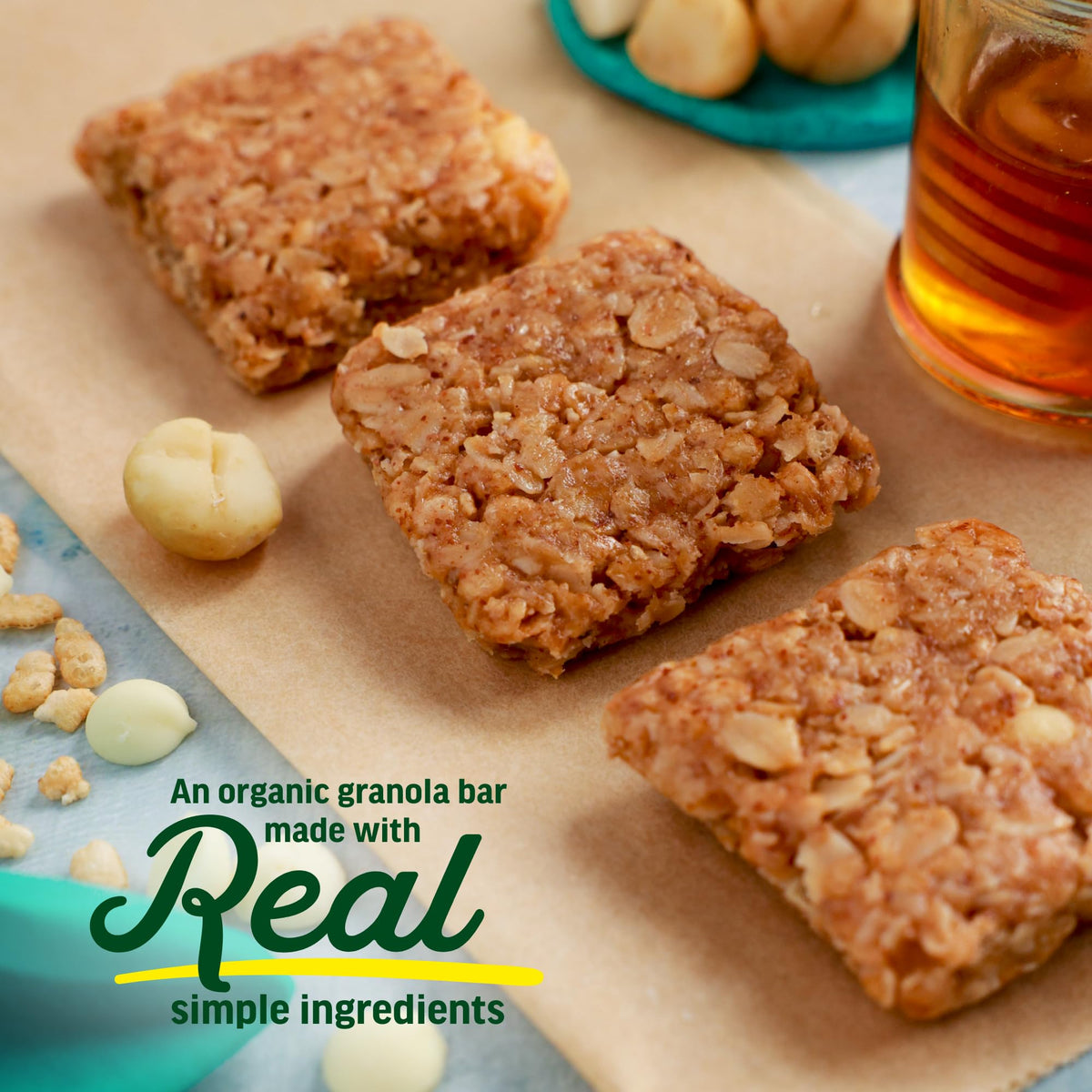 Kate’s Real Food white chocolate macadamia bar in hand shows convenient on-the-go nourishment.