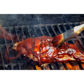 KC Masterpiece Kansas City Classic BBQ Sauce poured over pulled pork for depth