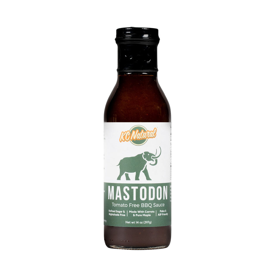 KC Natural Mastodon Paleo AIP BBQ Sauce bottle offering gluten-free glaze for grilling.