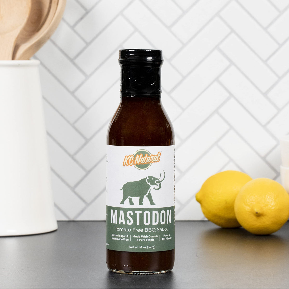 KC Natural Mastodon Paleo AIP BBQ Sauce label highlighting first Paleo Certified status.