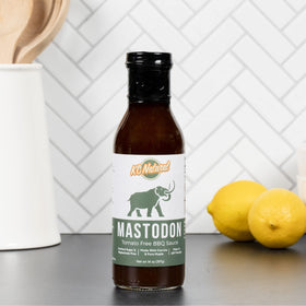 KC Natural Mastodon Paleo AIP BBQ Sauce label highlighting first Paleo Certified status.