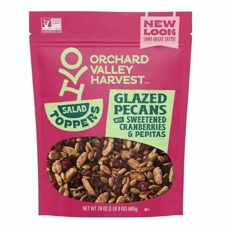 Close-up of glazed pecans on KD Chocolates salad toppers enhancing flavor on salads
