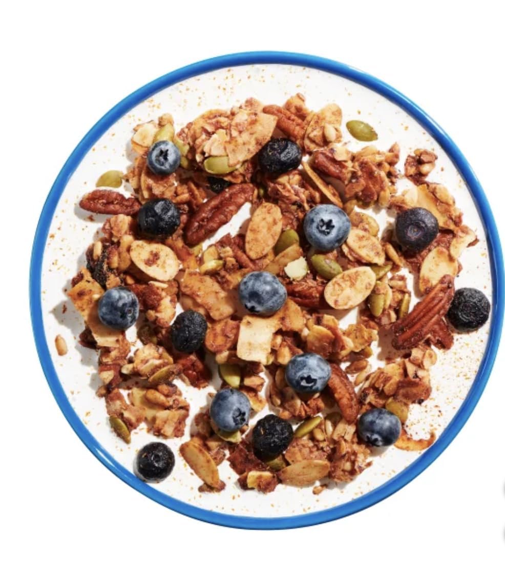 KD Chocolates NuTrael Granola served with berries and yogurt for a satisfying snack