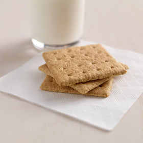 Kellogg's Honey Grahams Crackers stacked on store shelf for easy browsing